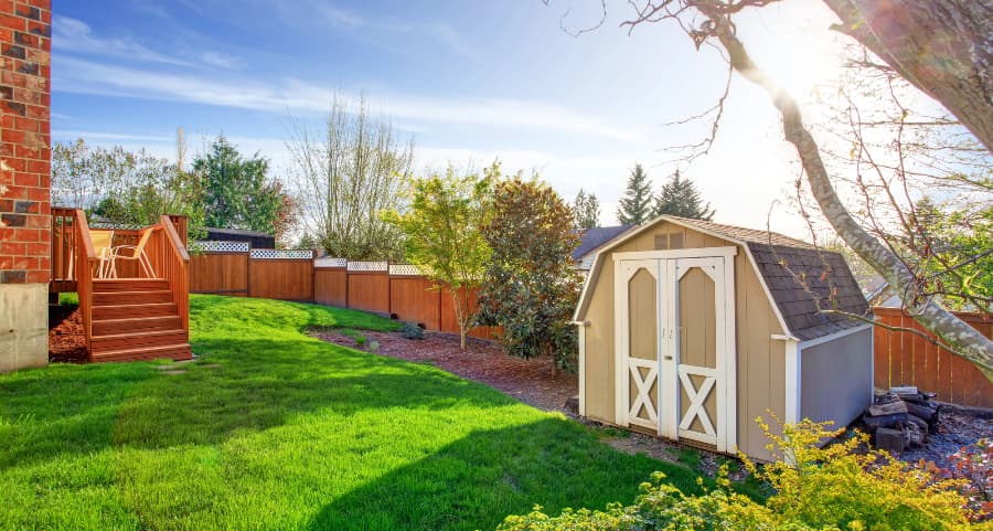 Fenced backyard with storage shed in Wilmington